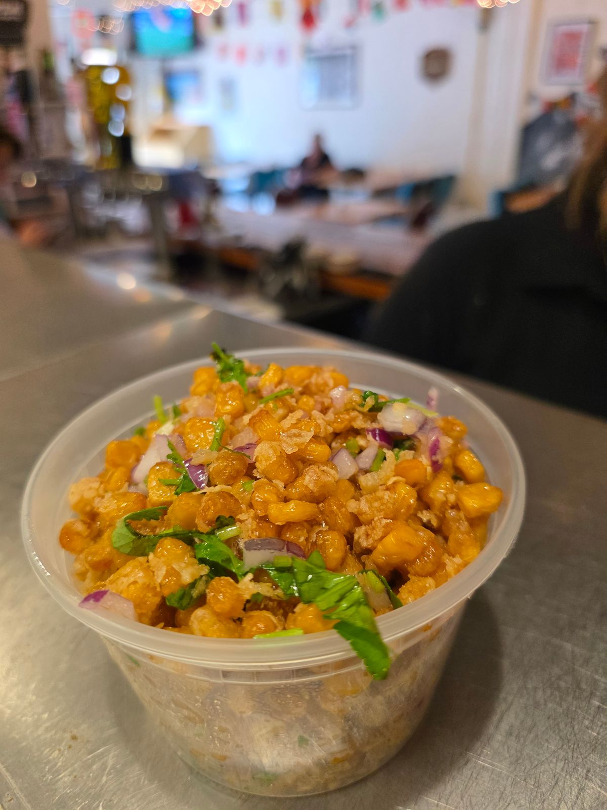 Crispy fried corn with onions and cilantro